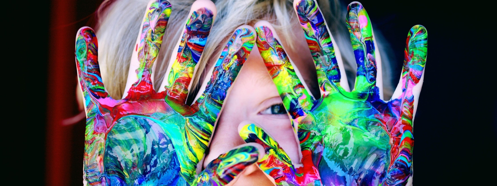 Child showing painted hands